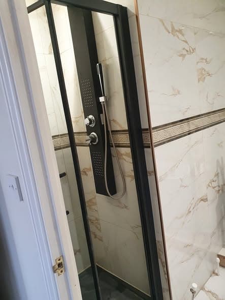Bathroom install with marble-effect tiling — Emir Handyman